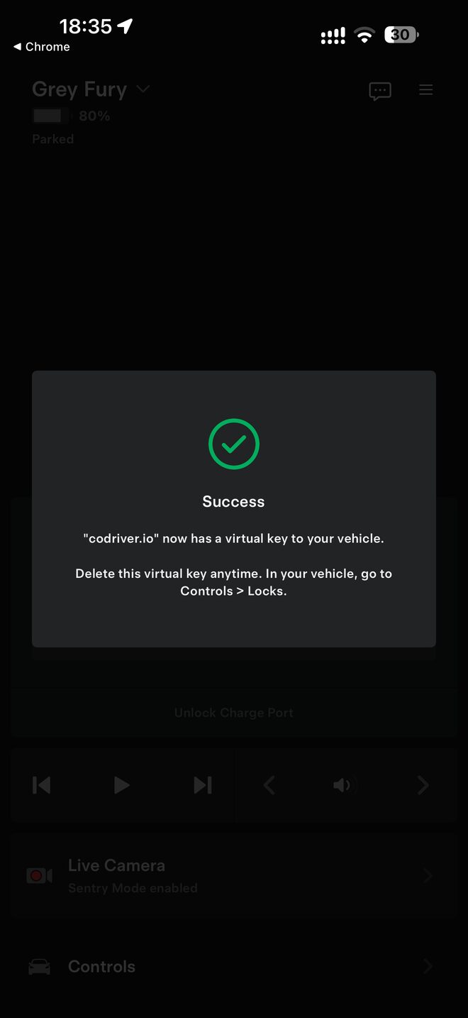 The Tesla app showing Success: codriver.io now has a virtual key to your vehicle